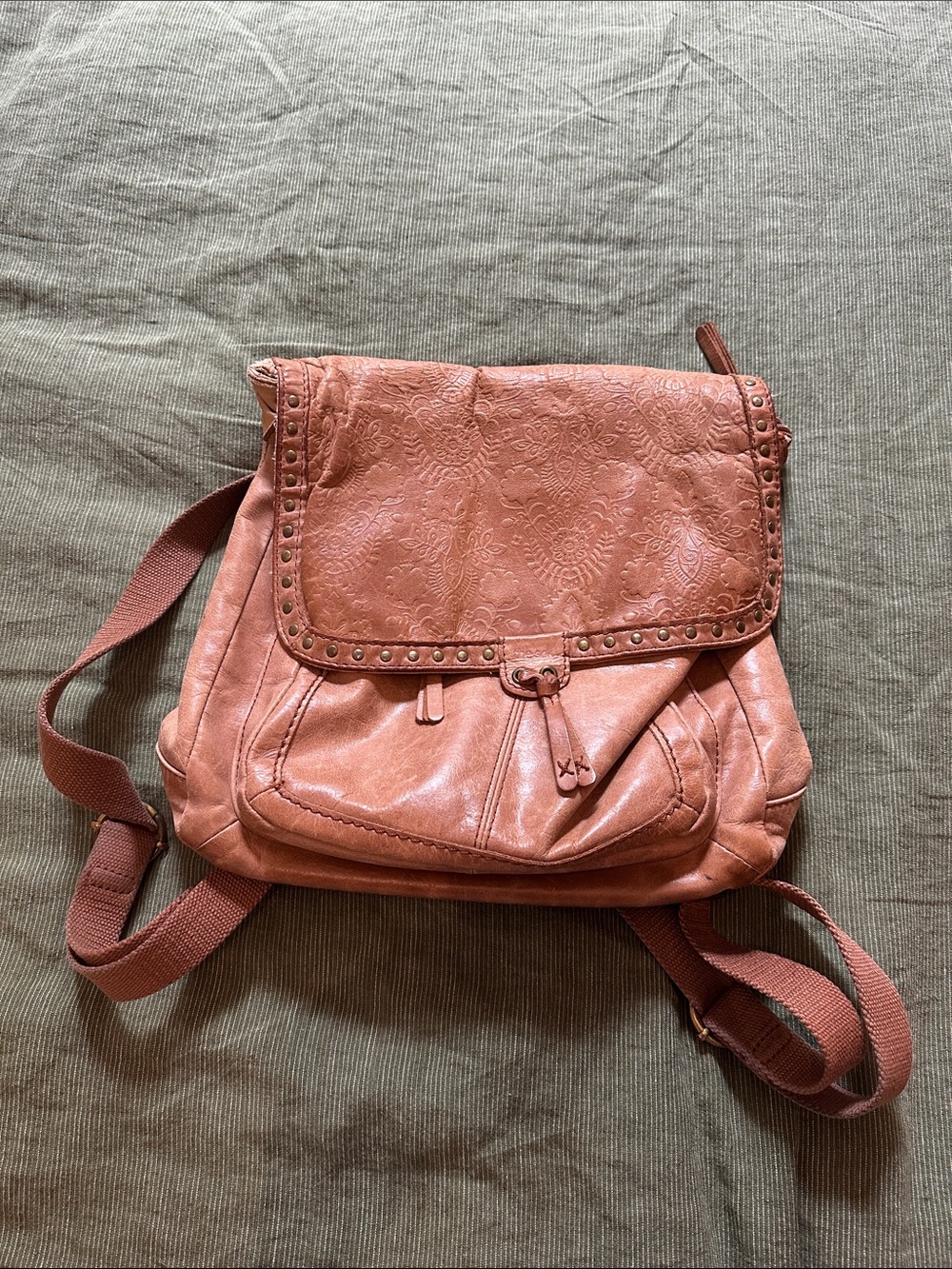 Women’s tooled floral leather adjustable backpack
